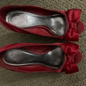 Red satin platform peep-toe pumps